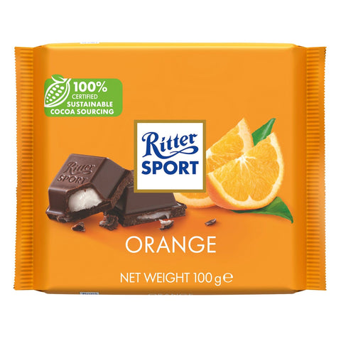 Ritter Sport dark chocolate bar with orange fondant by Jag Couture London - New York, showing the chocolate exterior and orange filling.