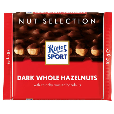 Jag Couture London New York Ritter Sport dark chocolate bar with whole hazelnuts, showing the chocolate piece with nuts inside.