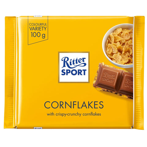 Jag Couture London New York Ritter Sport milk chocolate with crunchy cornflakes bar, shown with smooth milk chocolate exterior and cornflake pieces.