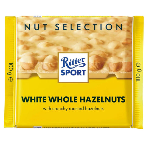 Jag Couture London New York Ritter Sport white chocolate with whole hazelnuts bar, showing the chocolate bar with visible hazelnuts.