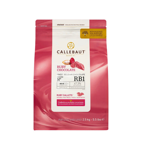 Jag Couture London New York Ruby Intense Fresh and Fruity Callets, vibrant red chocolate pieces in a clear container.