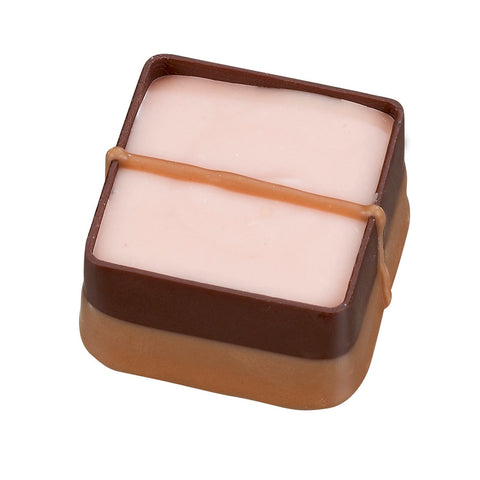Jag Couture London Rum and Raisin soft ganache with dark chocolate, showcasing a 16g piece with rich rum and raisin filling.