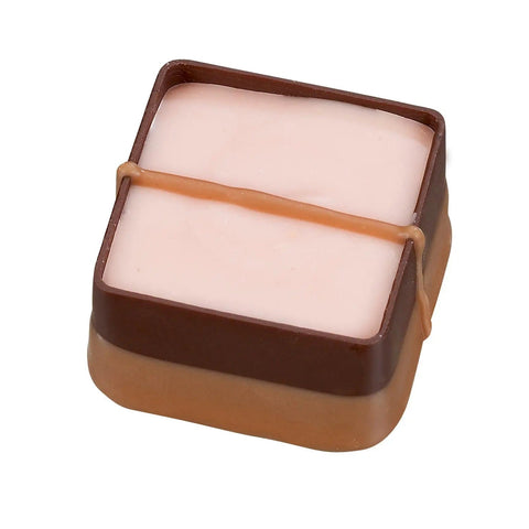 Jag Couture London New York Rum and Raisin soft ganache with dark chocolate, featuring rum and raisin pieces in a 16g treat