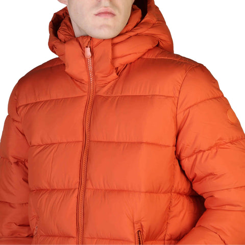 Orange Save The Duck Boris down-filled jacket by Jag Couture London New York, shown on a model outdoors.