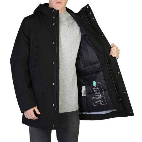 Save The Duck YOTAM-D40772M black down jacket by Jag Couture London New York, shown on a model in a city setting.