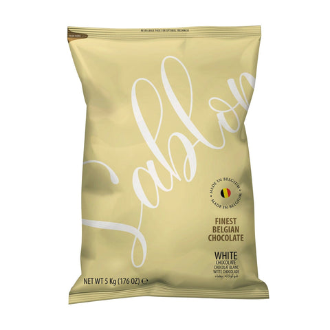 Jag Couture London New York Sablon 30% white chocolate in a bag, VAT-free, with visible white chocolate pieces inside.