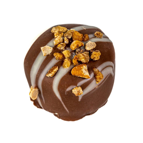 Milk chocolate salted caramel with roasted hazelnuts, 18g, from Jag Couture London - New York, shown in a close-up image.