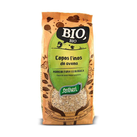 Organic Santiveri Thin Flakes Oatmeal by Jag Couture London New York, 500g package, close-up of flaky oat cereal in a bowl.