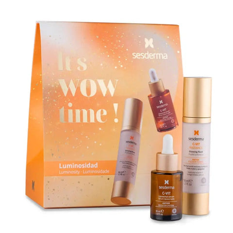 Two bottles of Sesderma Luminosity C Vit Liposomal Serum in 30ml set, featuring clear bottles with orange caps and serum inside.