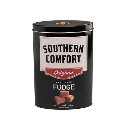 Jag Couture London New York Southern Comfort whisky-flavored fudge in a decorative tin, showcasing creamy fudge pieces inside.