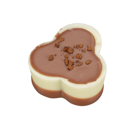 Strong coffee in a white cup with a coffee praline, featuring a bottom enrobed design, by Jag Couture London New York.