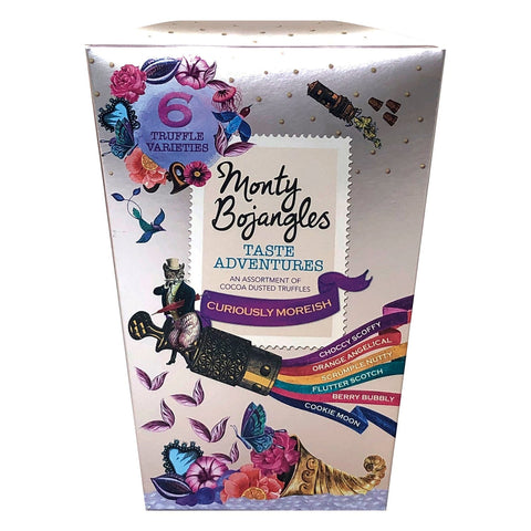 Assorted cocoa-dusted truffles in a Taste Adventures crown gift box by Jag Couture London New York, showcasing a variety of flavors.
