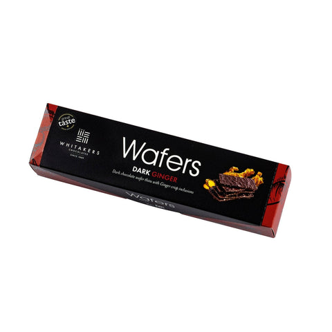Jag Couture London - New York Whitakers dark chocolate covered ginger wafers in a carton, showing the individually wrapped treats.