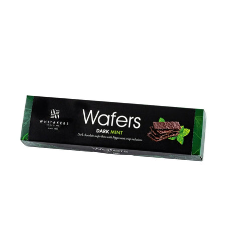 Whitakers dark chocolate-covered mint wafers in a carton, from Jag Couture London - New York, showing the chocolate-coated mint wafers.