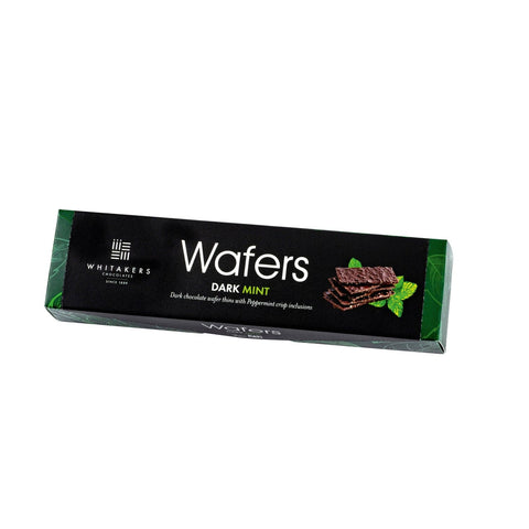 Whitakers dark chocolate-covered mint wafers in a carton, presented by Jag Couture London New York, with visible wafers and chocolate coating.