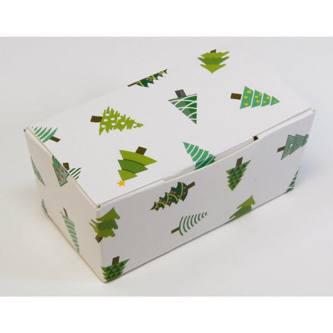 White chocolate box with Christmas tree design by Jag Couture London New York, featuring festive holiday-themed packaging.